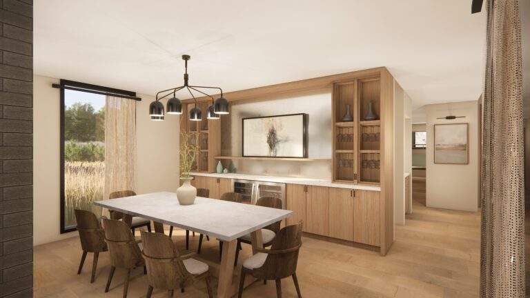Modern dining room with a rectangular table, six chairs, a black chandelier, wood cabinetry, large artwork, and floor-to-ceiling window with sheer curtains offering vineyard views near Lake Chelan in North Central Washington.