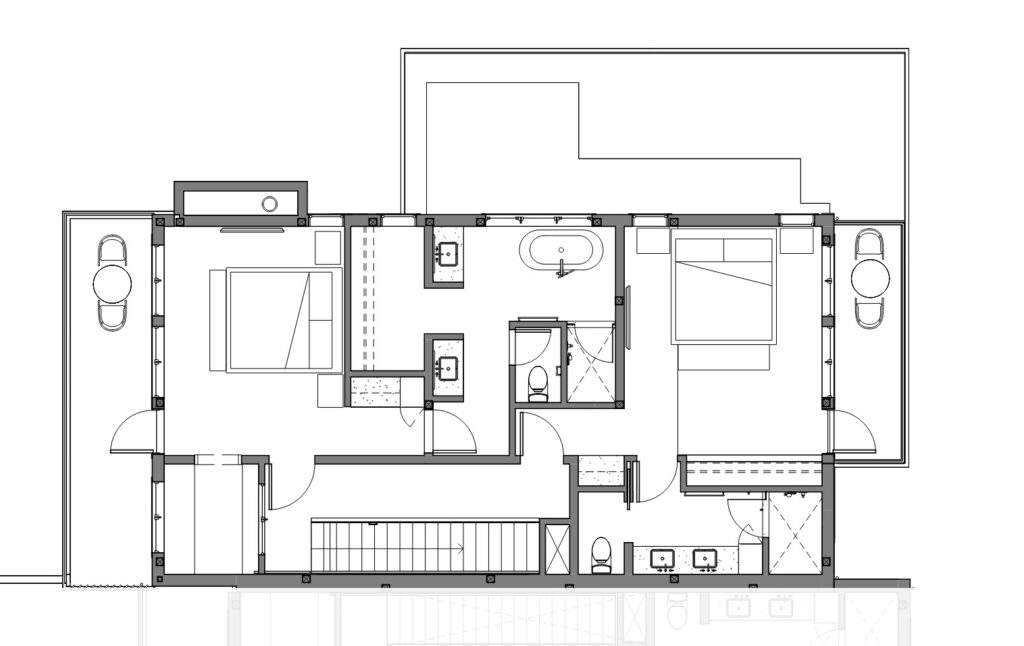 Black and white floor plan of Rocky Pond Estate near Lake Chelan, featuring two bedrooms, three bathrooms, a central hallway, two garages, extra rooms, outdoor areas, and stunning vineyard views.