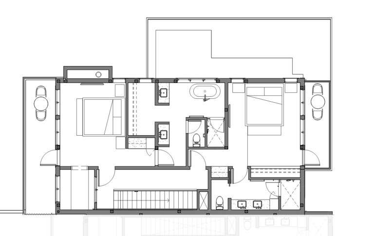 Black and white floor plan of Rocky Pond Estate near Lake Chelan, featuring two bedrooms, three bathrooms, a central hallway, two garages, extra rooms, outdoor areas, and stunning vineyard views.