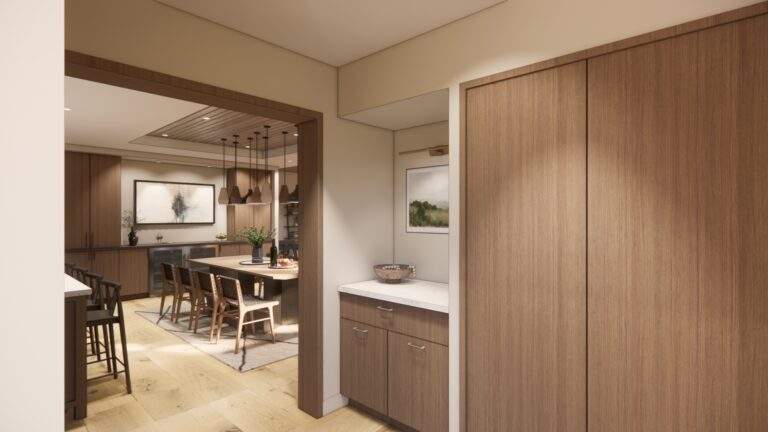 Modern kitchen and dining area with wooden cabinets, a countertop, and a table with chairs; neutral colors and soft lighting complement stunning vineyard views at Rocky Pond Estate in North Central Washington.